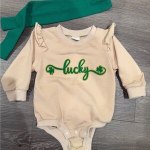 Cream Baby Onesie with Green 'Lucky' Embroidery